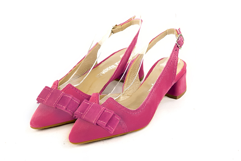 Fuschia pink women's open back shoes, with a knot. Tapered toe. Low flare heels. Front view - Florence KOOIJMAN